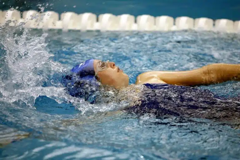 swimmer racing backstroke on swim team knoxville tn